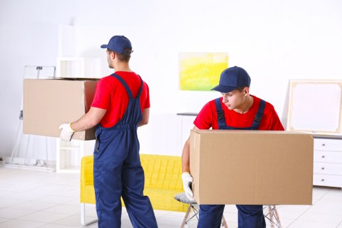 Team member loading furniture safely into a van