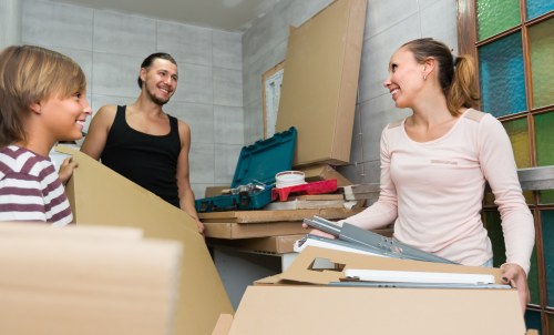 Removal team planning a home move in Chiswick with boxes and furniture