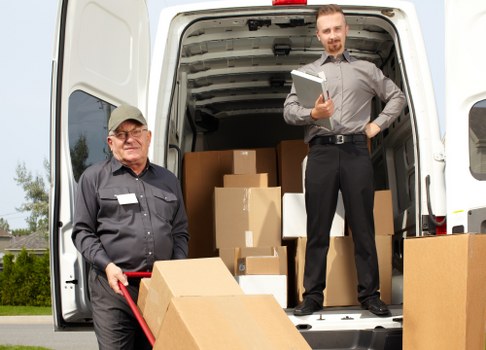 Man with van loading furniture for a move in Chiswick