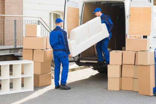 Local moving van helping with furniture transport in Chiswick