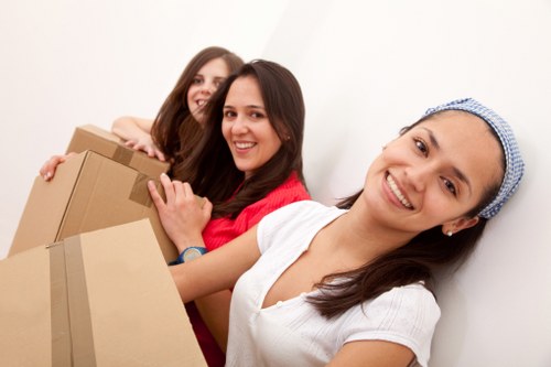 Moving boxes and furniture prepared for transport in Chiswick