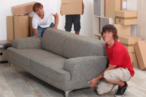 Professional movers loading furniture into a van