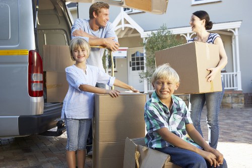 Packed boxes and furniture ready for a house move in Chiswick