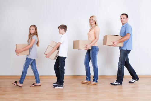 Local moving truck loading furniture for a west London move